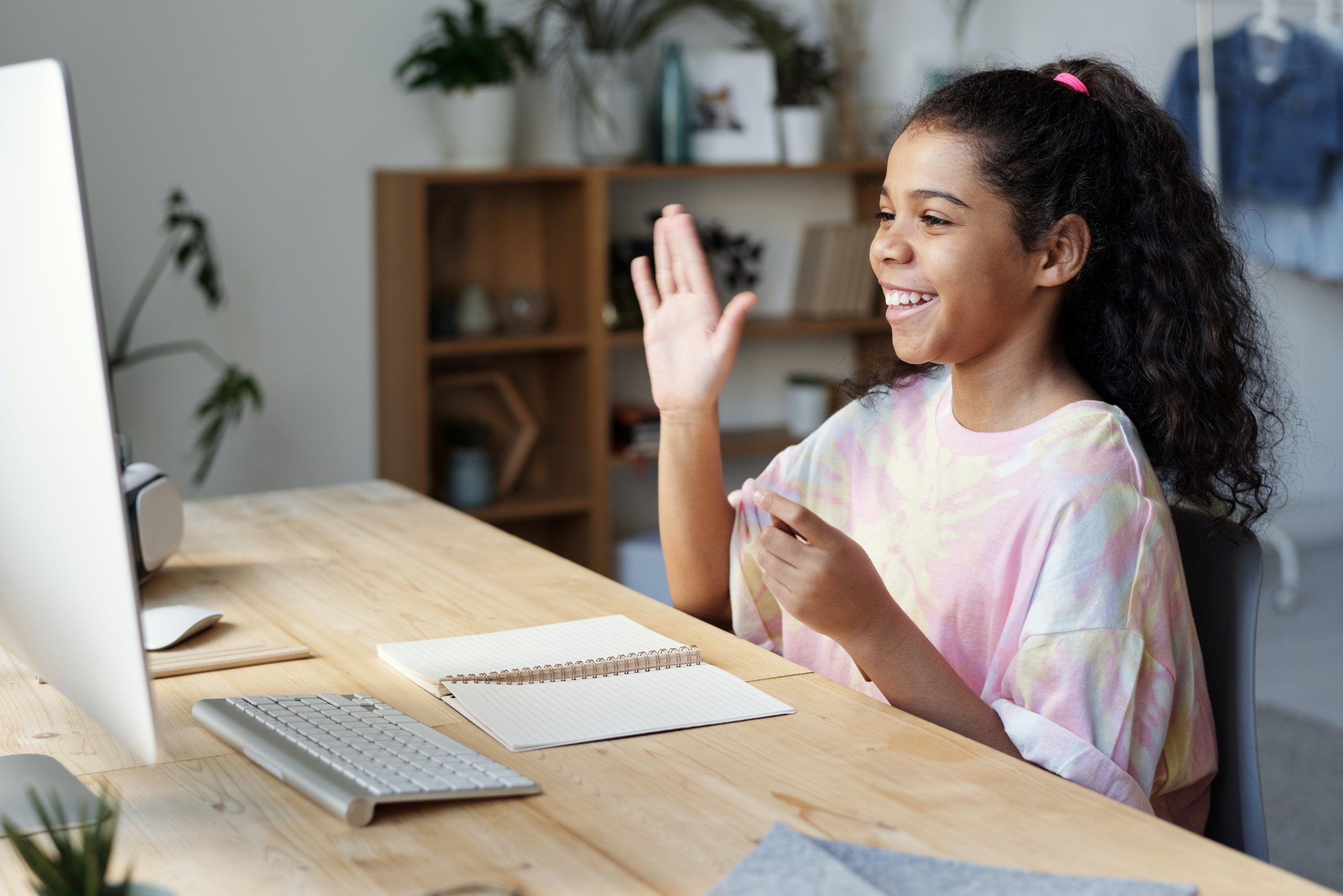 online learning, girl raising hands